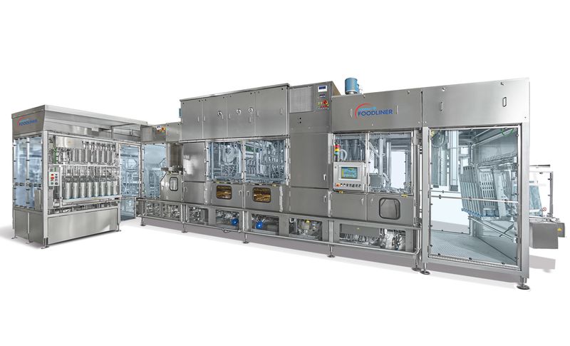 Auslieferung GRUNWALD-Längsläufer-Becherfüller mit peroxidfreiem Ultraclean-(UC)-Hygienekonzept